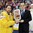 MINSK, BELARUS - MAY 25: Sweden's Joel Lundqvist #20 receives the bronze medal trophy from IIHF Vice-President Thomas Wu after a 3-0 bronze medal game win over the Czech Republic at the 2014 IIHF Ice Hockey World Championship. (Photo by Andre Ringuette/HHOF-IIHF Images)